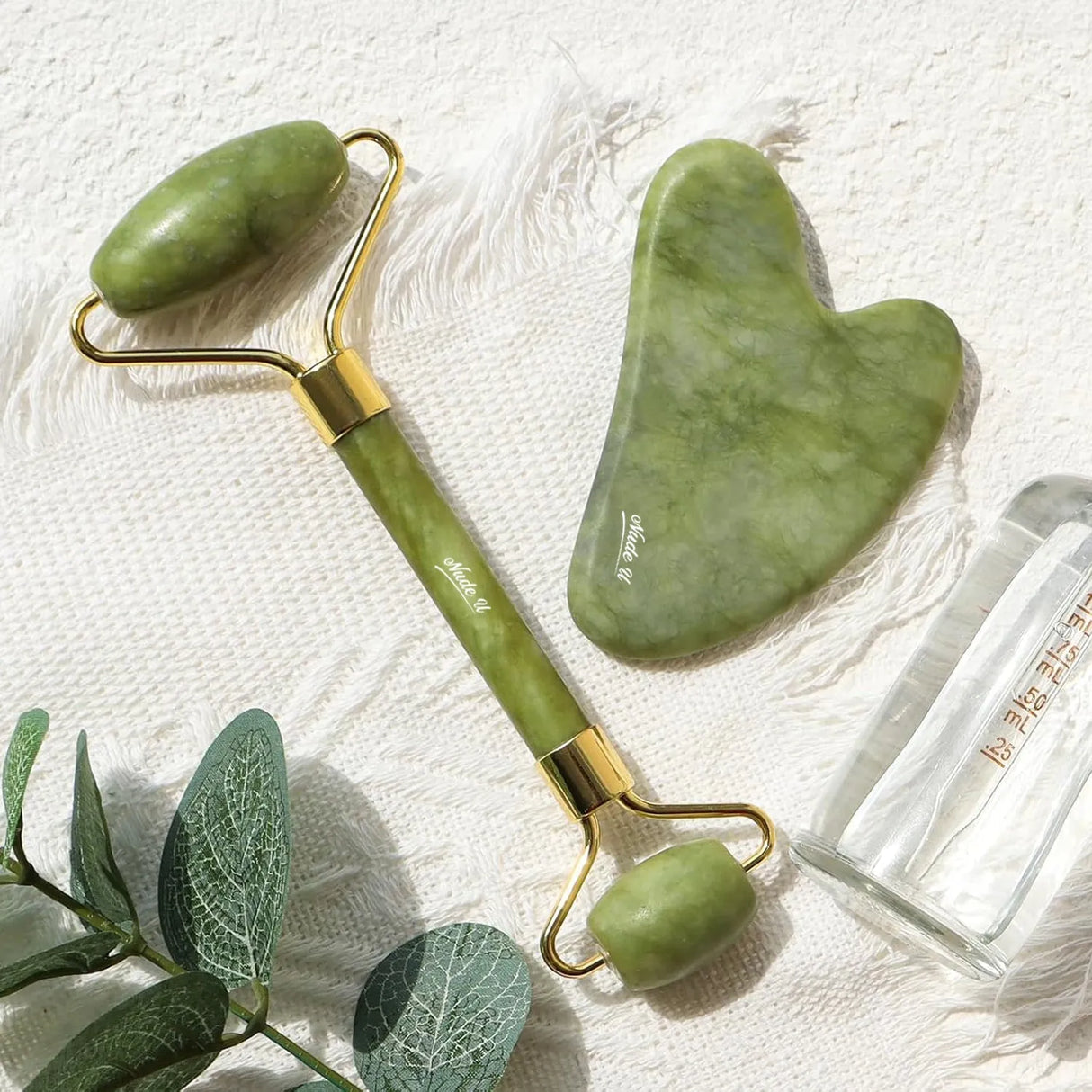 Close-up of the Jade Roller highlighting its smooth, polished surface.