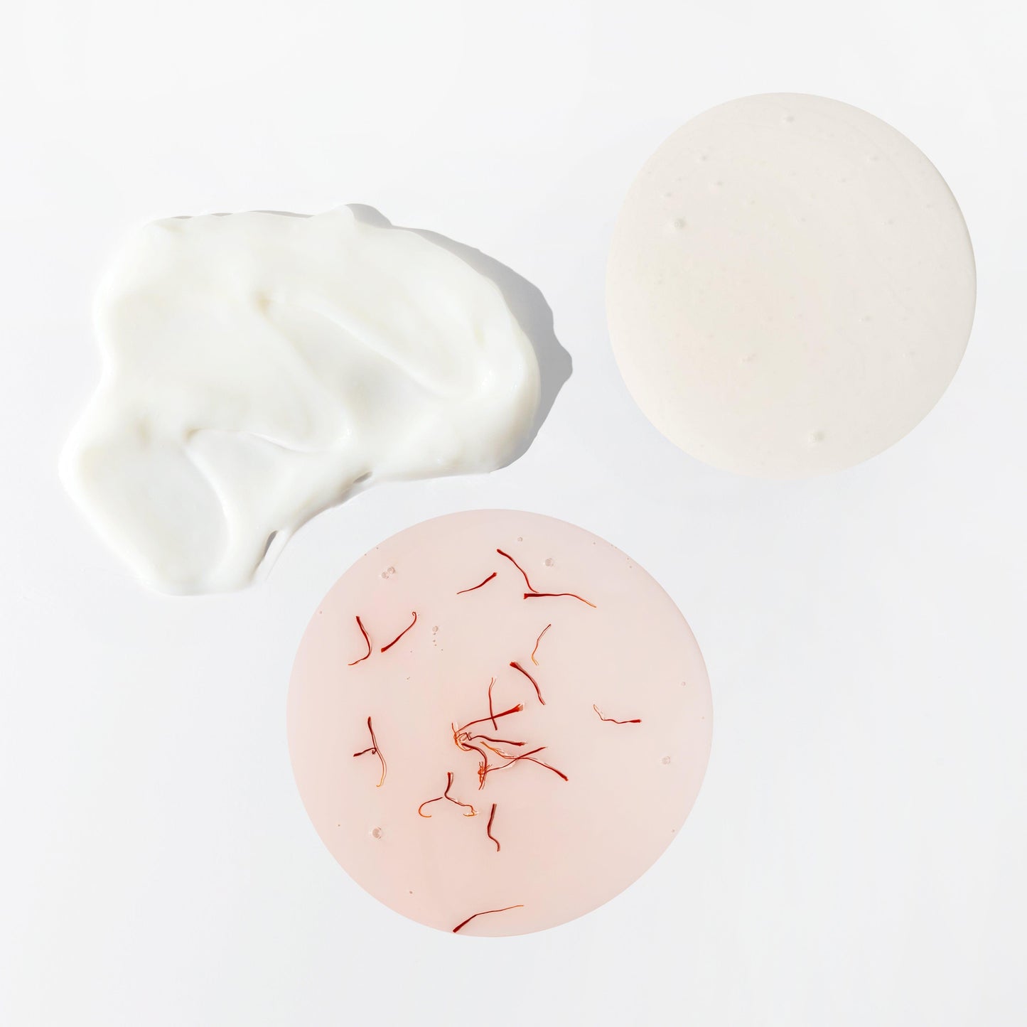 Detail image of JOON shampoo, conditioner, and hair oil textures.