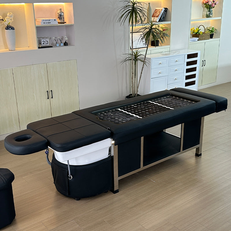 Lifestyle image of the black SSW 611-2D Fresh Water Japanese Head Spa Massage Bed in a salon.
