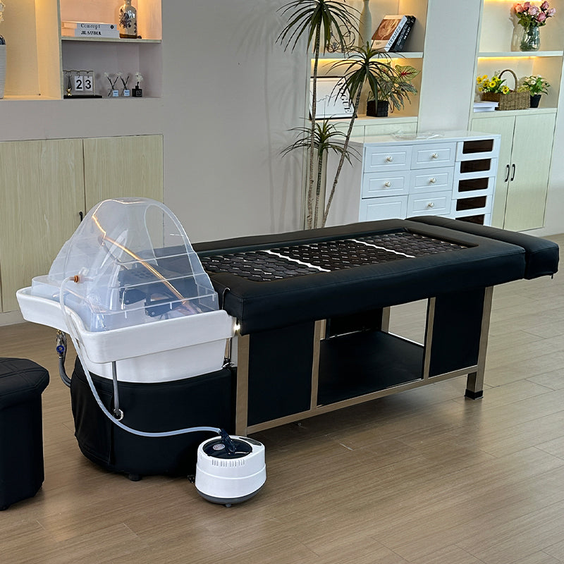 Lifestyle image of the black SSW 611-2D Fresh Water Japanese Head Spa Massage Bed in a salon.