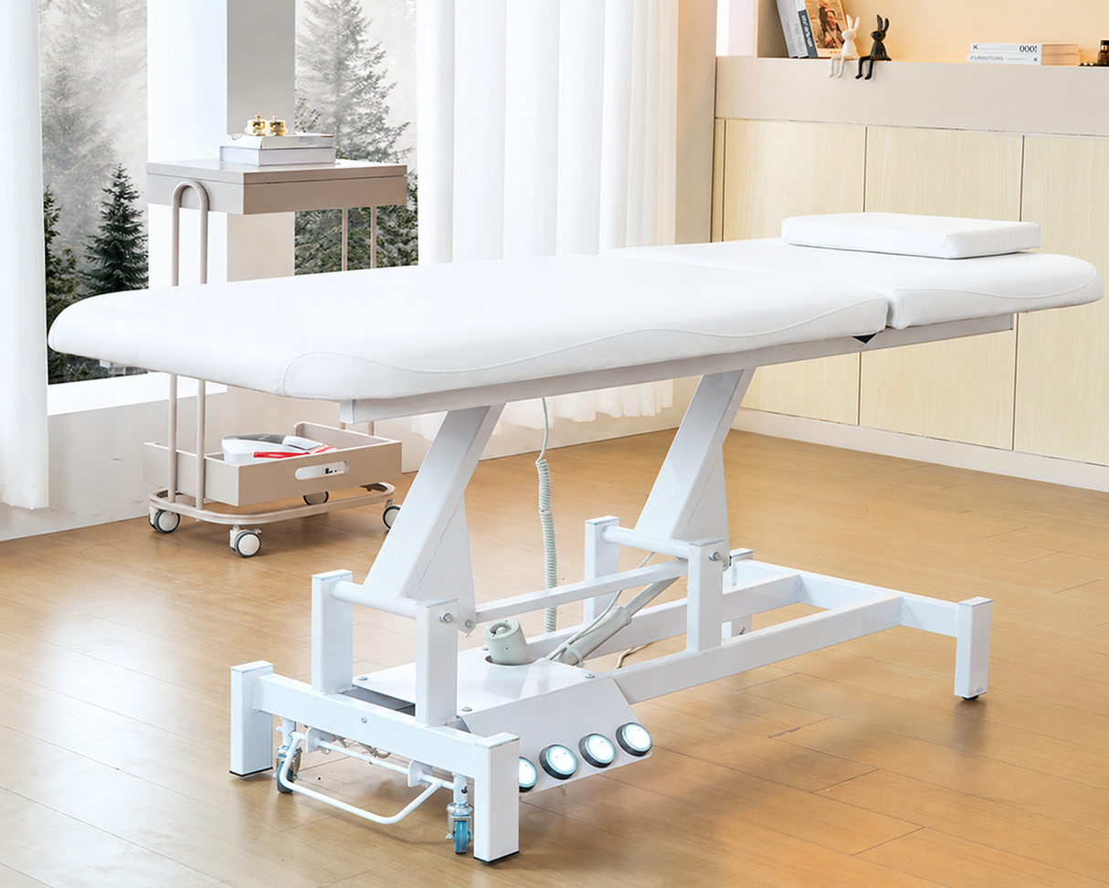 Image shows the white SSW 813 Electric Treatment Table raised up.