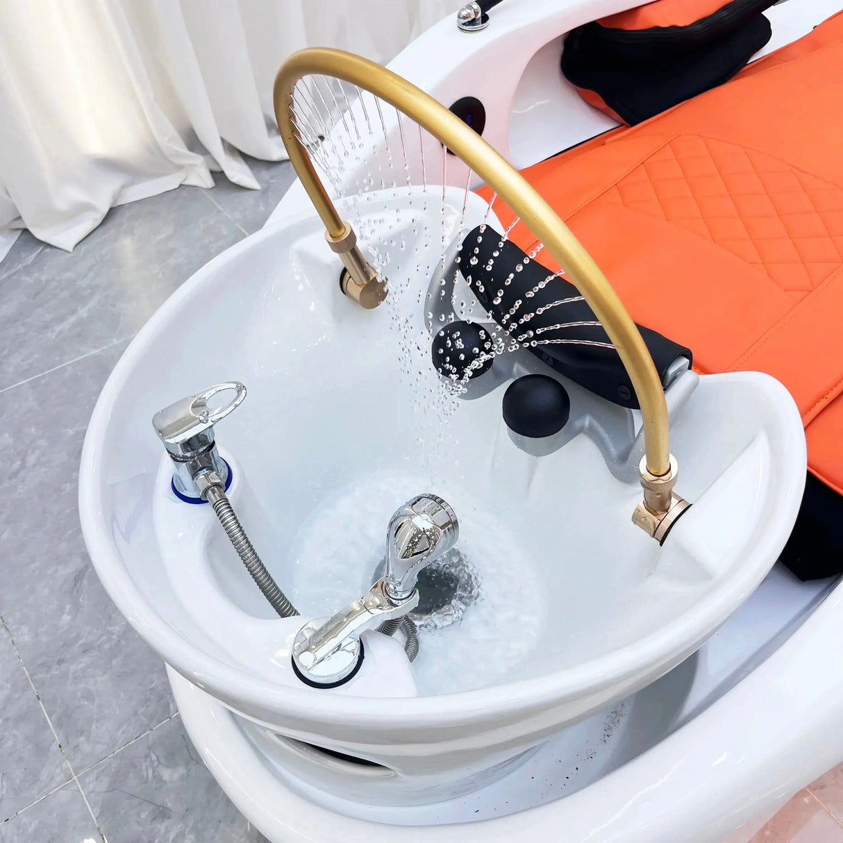Detail image of the sink on the orange SSW XL780 Japanese Head Spa Massage Bed