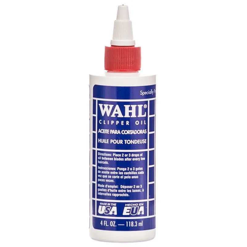 Bottle of Wahl Clipper Oil with a red cap, labeled for lubricating electric clippers, 4 fl.oz. size.