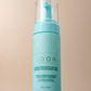 Close-up of Katira Volumizing Mousse bottle with a sleek, clean appearance.