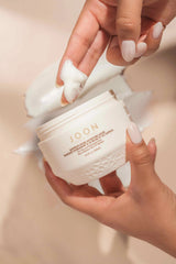 Moisture Mask being applied to model's fingers.