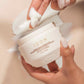 Moisture Mask being applied to model's fingers.