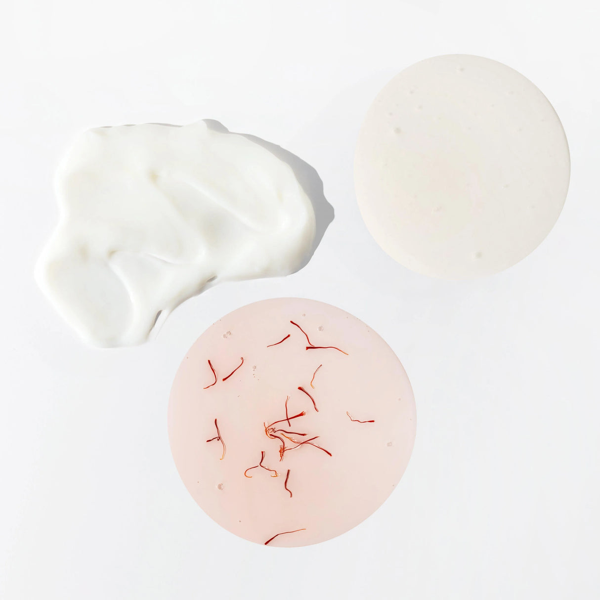 Detail image of JOON shampoo, conditioner, and hair oil textures. 