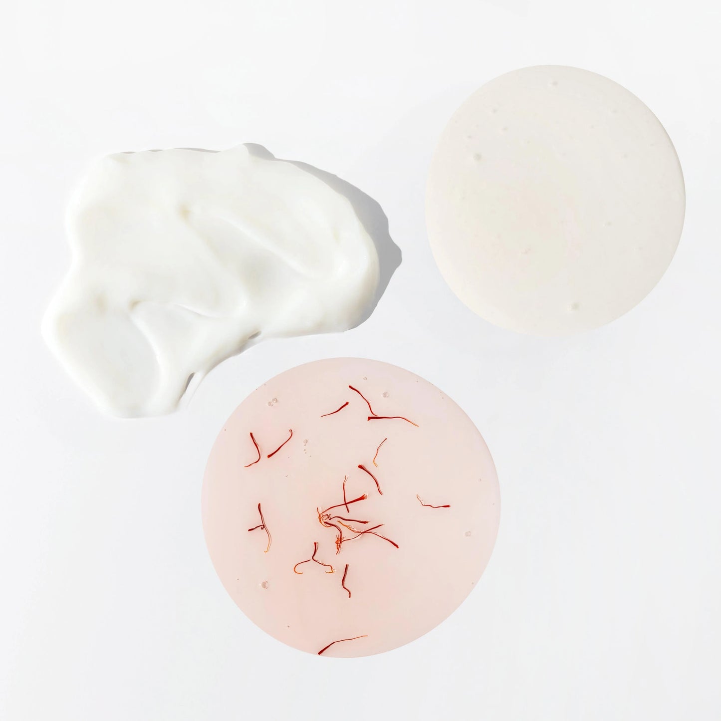 Detail image of JOON shampoo, conditioner, and hair oil textures. 