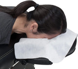 Model uses NudeU Disposable Face Cradle Covers on massage bed. 