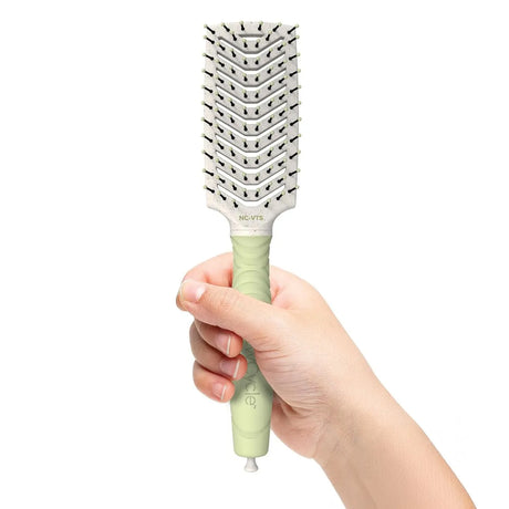 A model holds the NC-VTS Vent Styler from Olivia Garden.