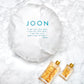 LIfestyle image showcasing JOON shower cap with other JOON family products. 