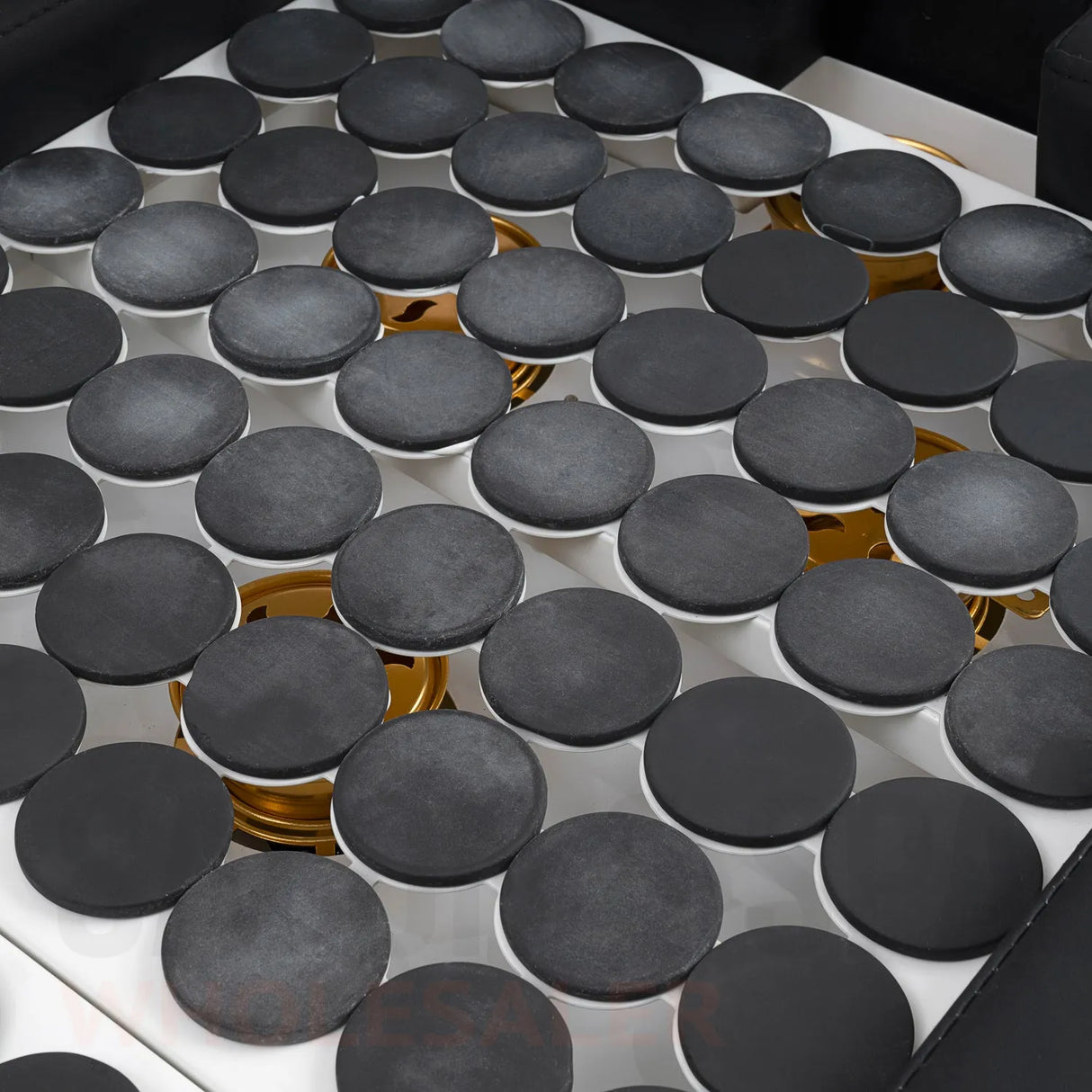 Detail image of the hot stones on the black SSW 611-2 Japanese Head Spa Massage Bed. 