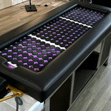 Detail image of the hot stones on the black SSW 611-2D Fresh Water Japanese Head Spa Massage Bed. 