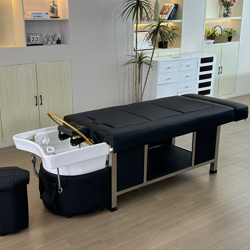 Lifestyle image of the black SSW 611-2D Fresh Water Japanese Head Spa Massage Bed in a salon.