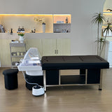 Lifestyle image of the black SSW 611-2D Fresh Water Japanese Head Spa Massage Bed in a salon.