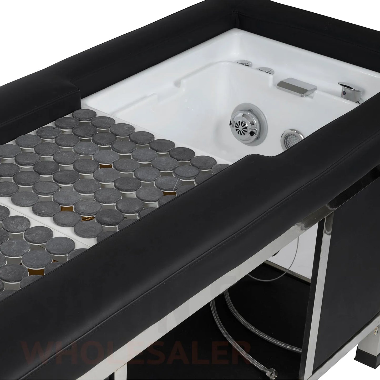 Detail image of the hot stones and foot basin on the SSW 611-4 Japanese Head Spa Massage Bed. 