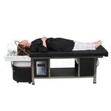 Profile view of a model on the black SSW 611-4 Japanese Head Spa Massage Bed. 
