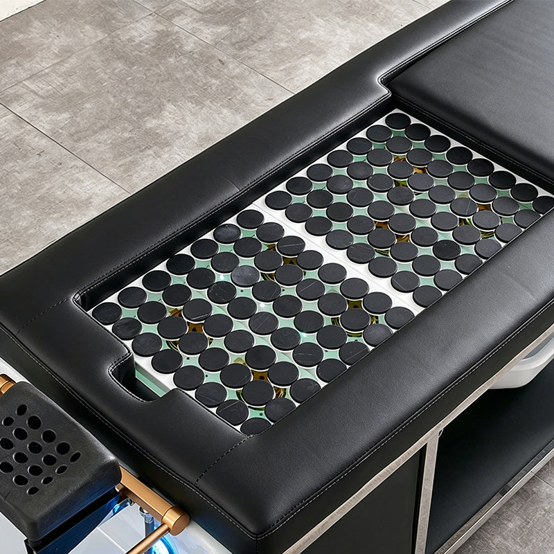 Detail image of the hot stone plates on the black SSW 611-4D Fresh Water Japanese Head Spa Massage Bed