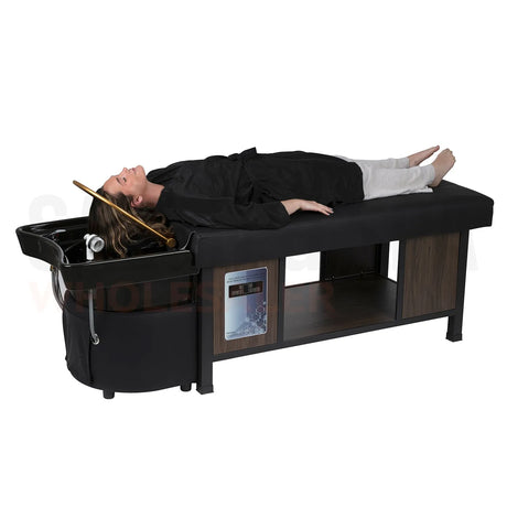Model on the black/black SSW 611-5C Japanese Head Spa Massage Bed. 