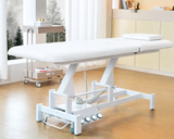 Image shows the white SSW 813 Electric Treatment Table raised up.