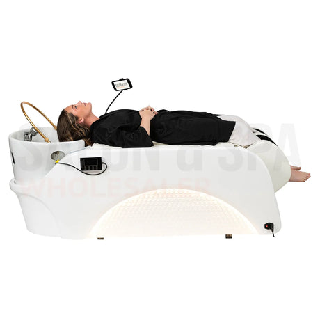 Model on the SSW A035 Japanese Head Spa Massage Bed. 