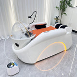 Profile view of the orange SSW XL780 Japanese Head Spa Massage Bed